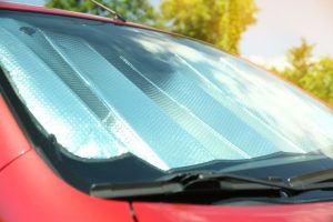 Sun shade on windshield of car